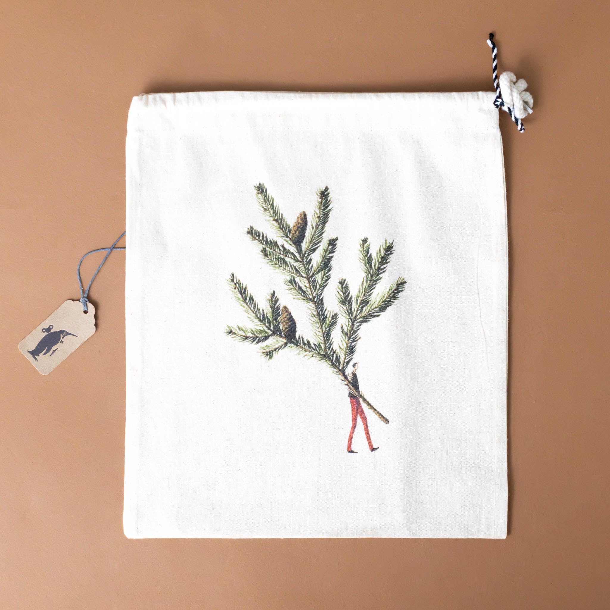 cotton-drawstring-pouch-man-holding-a-sprig-of-spruce