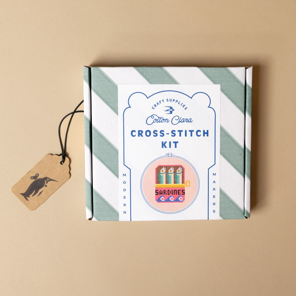 cross-stitch-kit-sardines with a striped design on a beige background