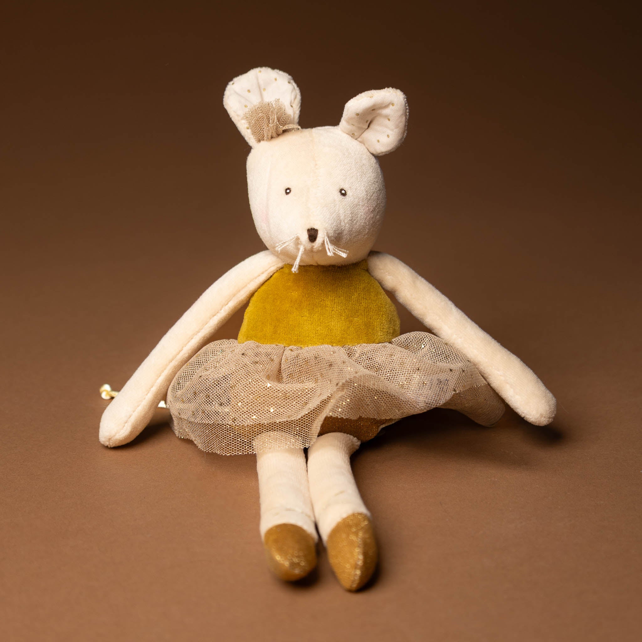 dance-mouse-golden-belle Stuffed toy mouse in a  dress with a sheer skirt on a brown background