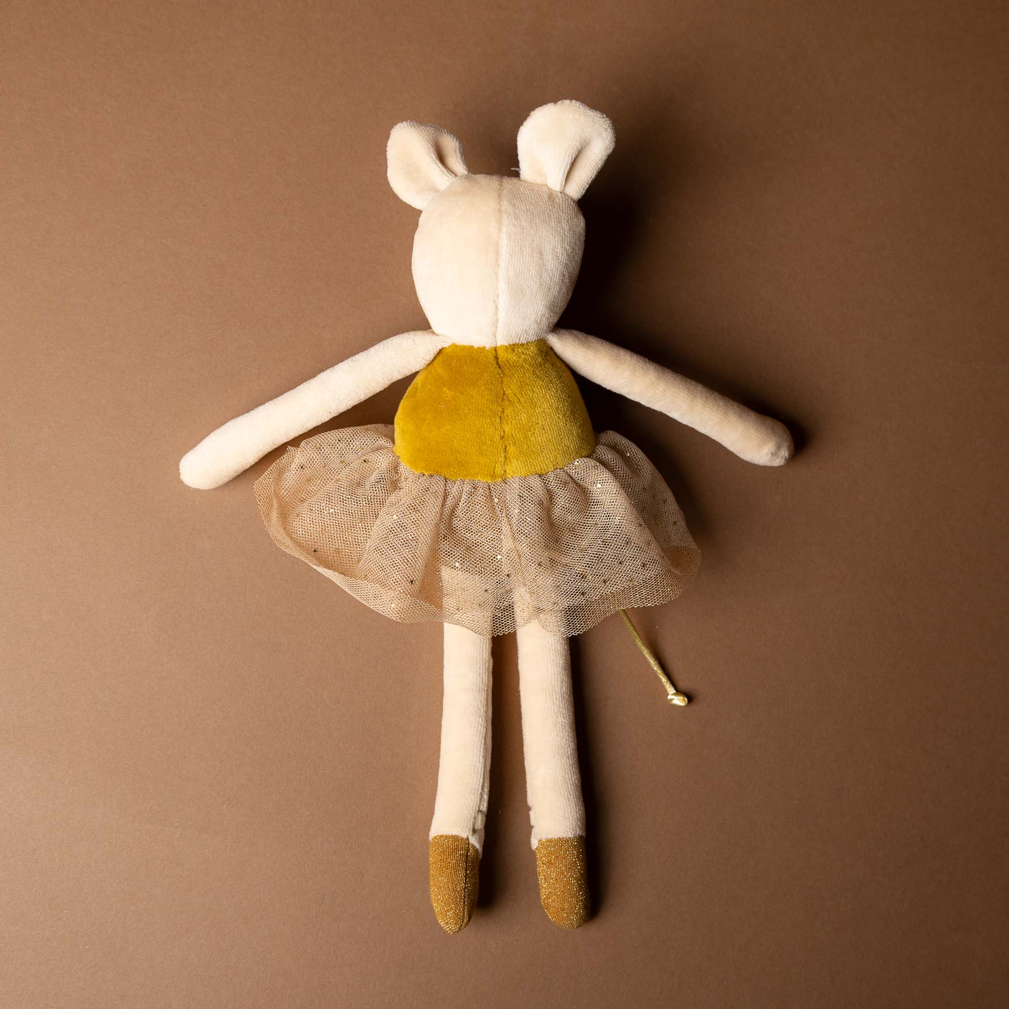 dance-mouse-golden-belle Stuffed toy mouse in a yellow dress on a brown background