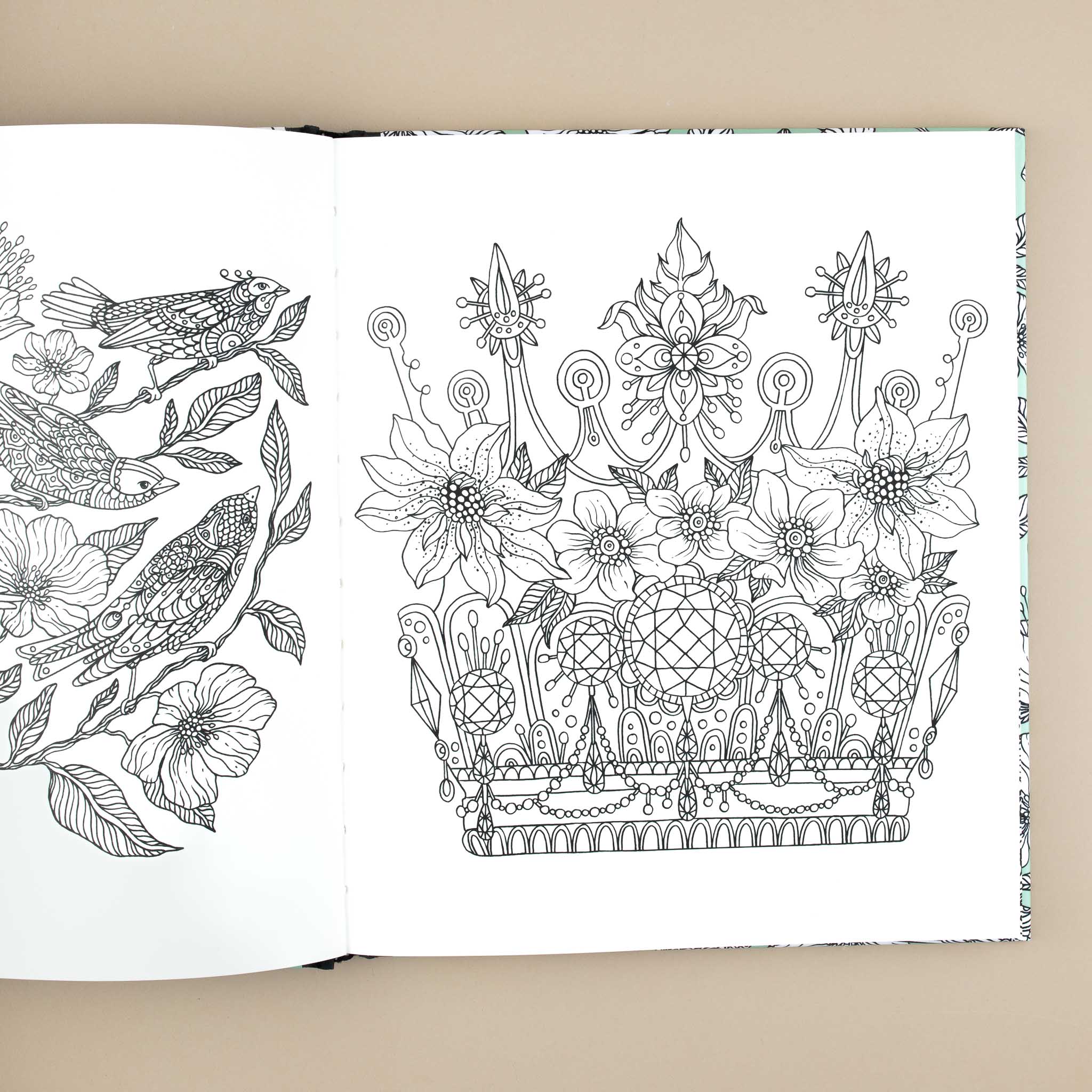 open-book-showing-crown-with-flowers