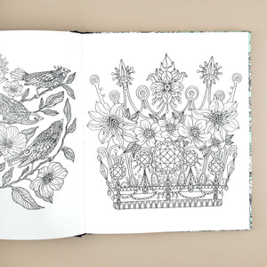 open-book-showing-crown-with-flowers