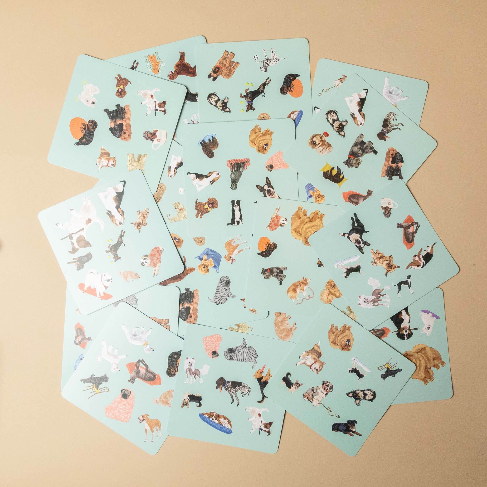 dog-spotter-game Set of playing cards with dog illustrations on a beige background