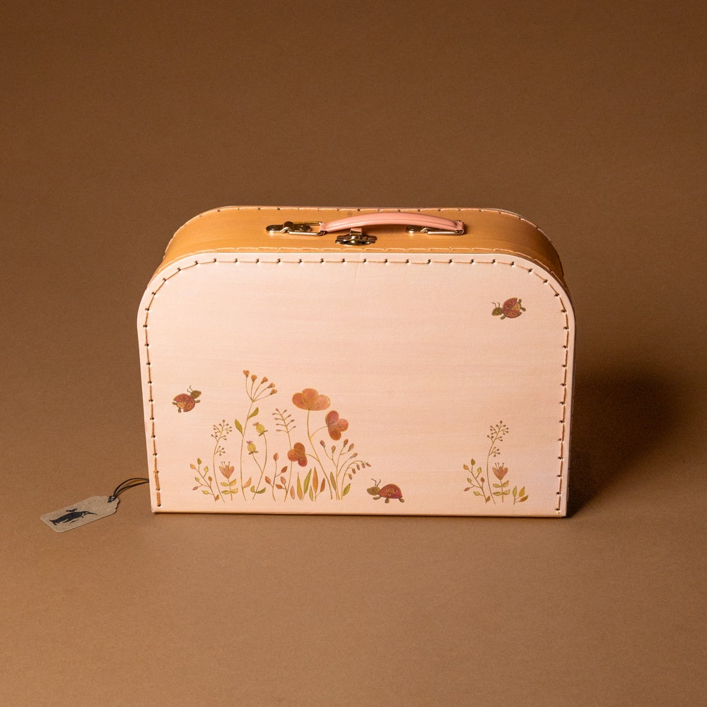 embroidery-craft-kit-ladybugs-and-flowers Small suitcase with floral design on a brown background