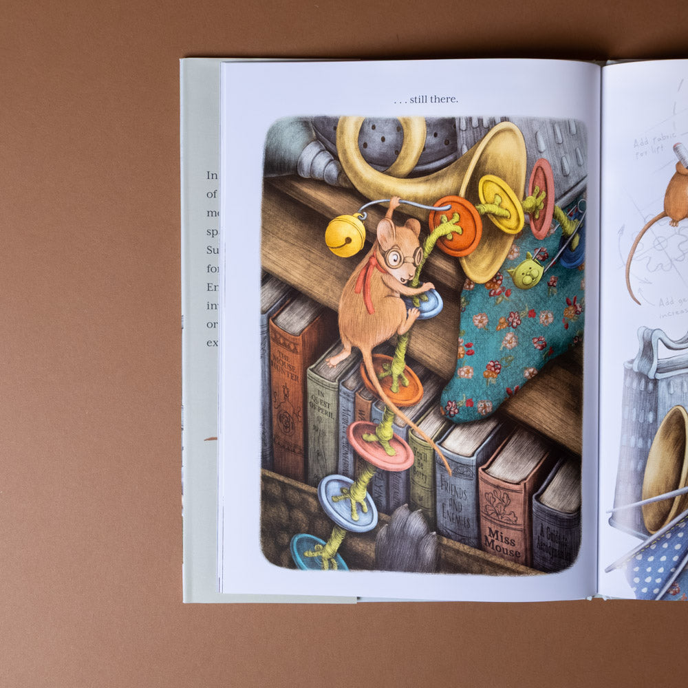 emmie-builds-something-new Illustrated book open to a page with colorful characters on a brown background