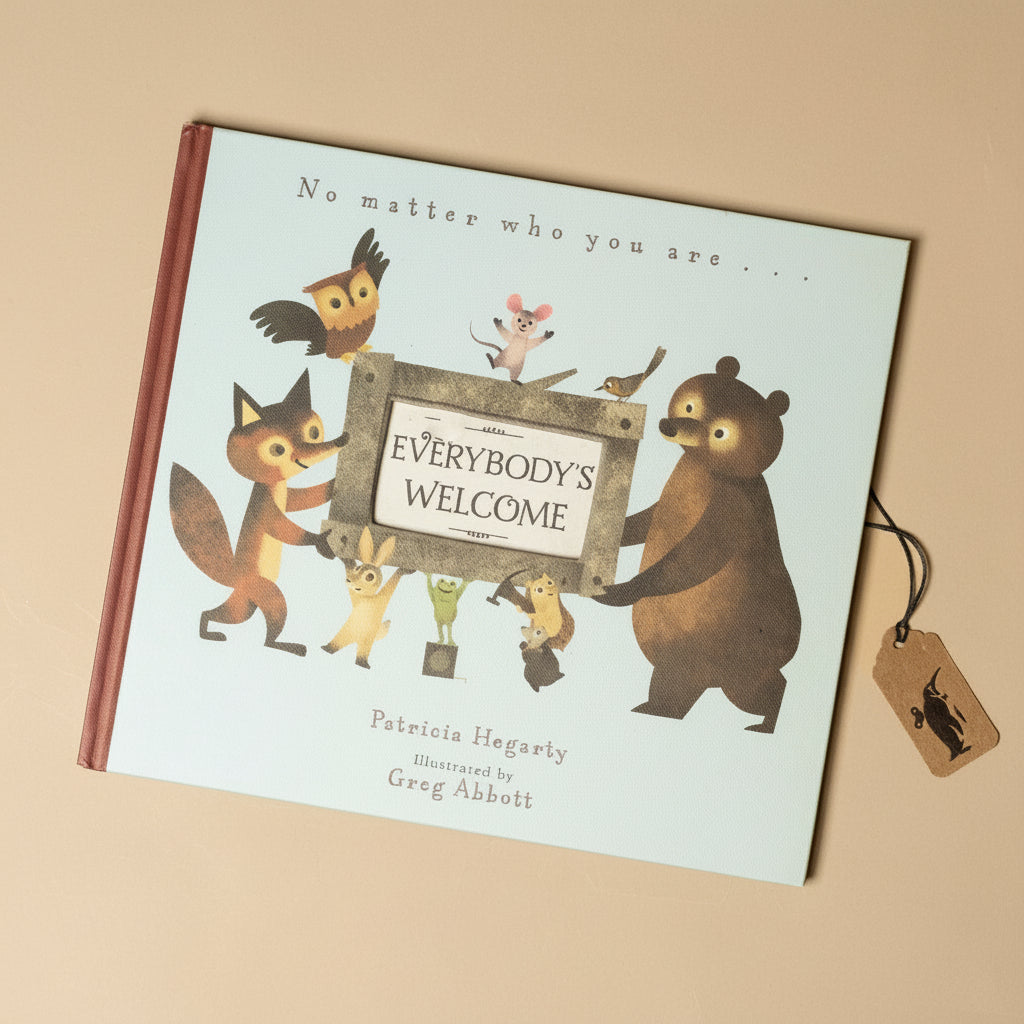 everybodys-welcome-book-cover-with-a-variety-of-animals-carrying-a-sign-saying-everybodys-welcome