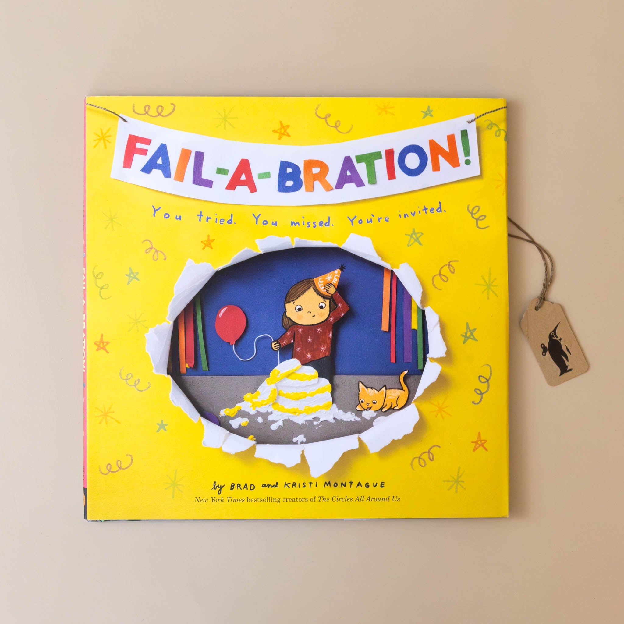 fail-a-bration-yellow-book-cover-with-banner-and-birthday-girl-with-fallen-birthday-cake