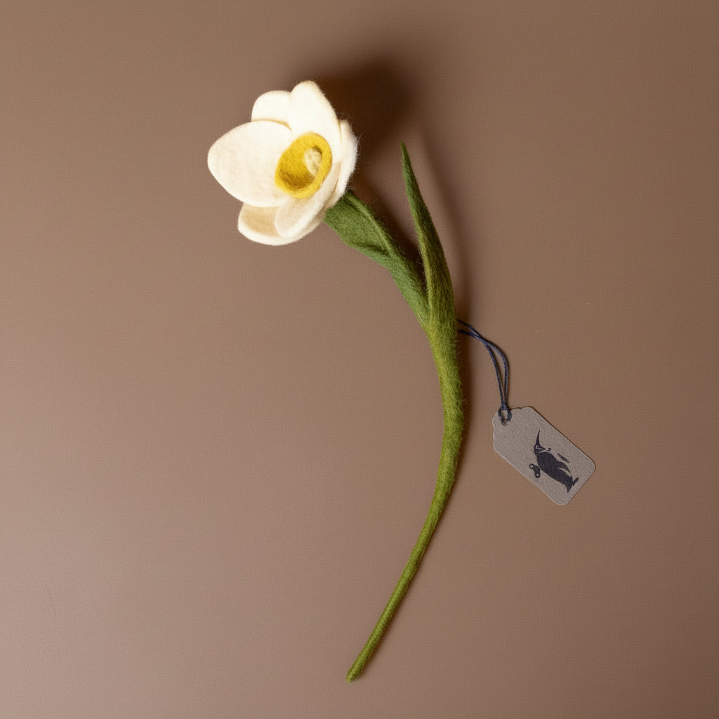 felt-daffodil-stem-white with a green stem on a brown background