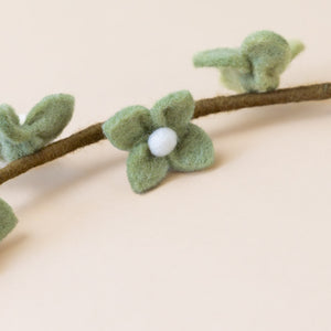 felt-flower-stalk-mint-green-close-up-four-petals-with-white-center