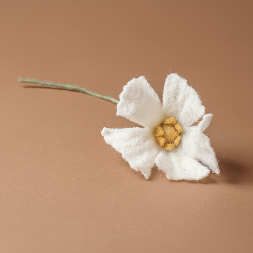 felt-poppy-flower-white felt flower with a brown background