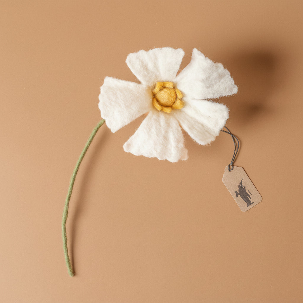 felt-poppy-flower-white felt flower with a brown background