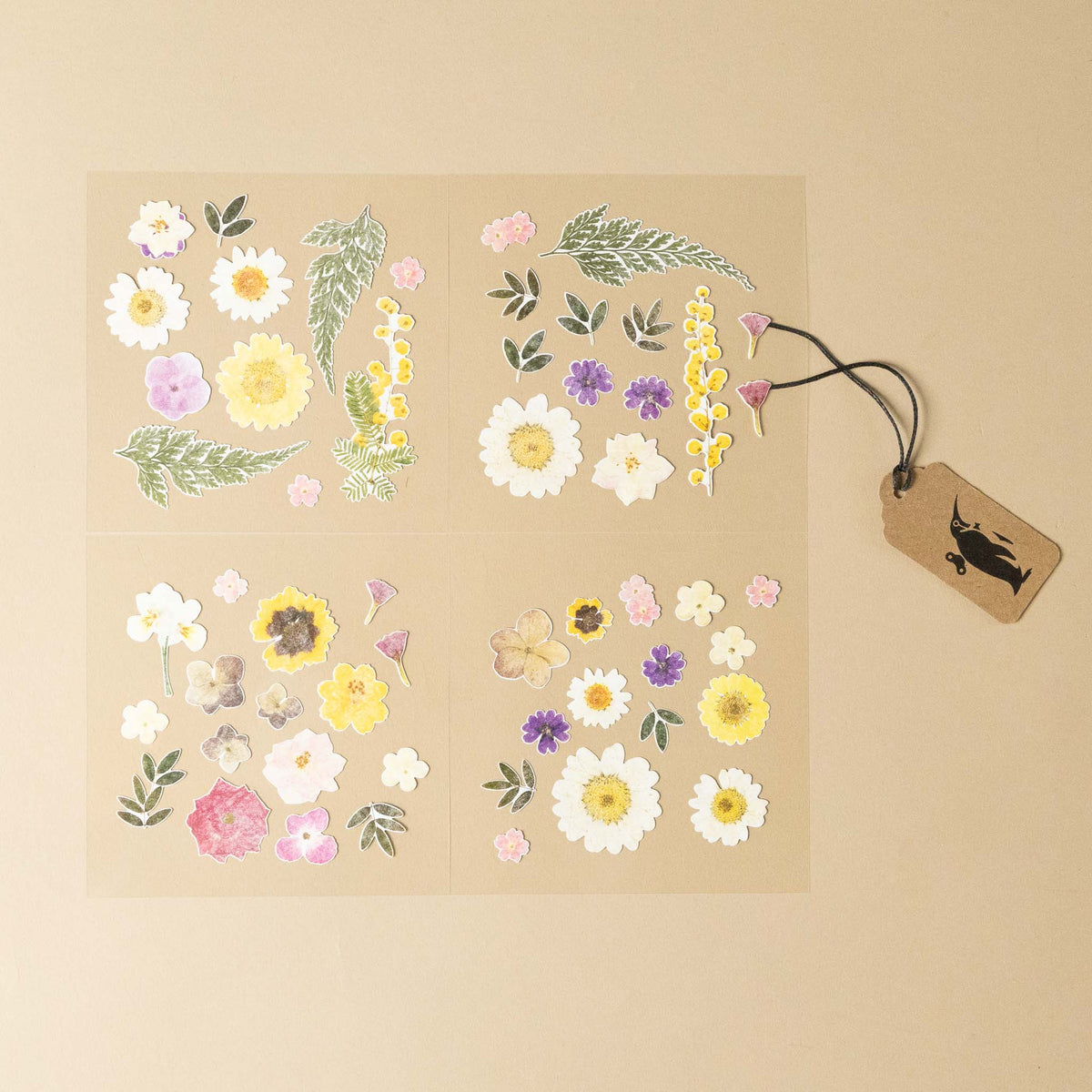 Sheet of floral stickers with a tag on a beige background