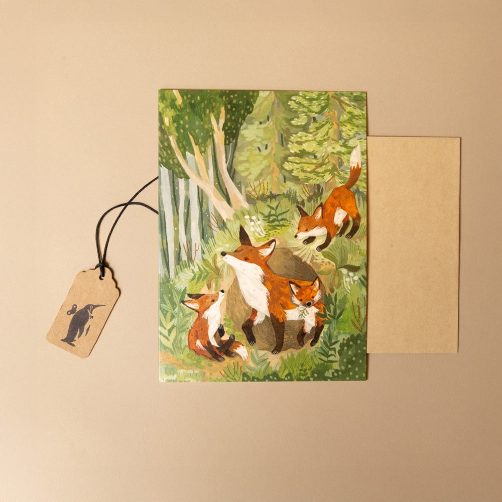 fox-den-greeting-card with fox illustration and envelope on a beige background