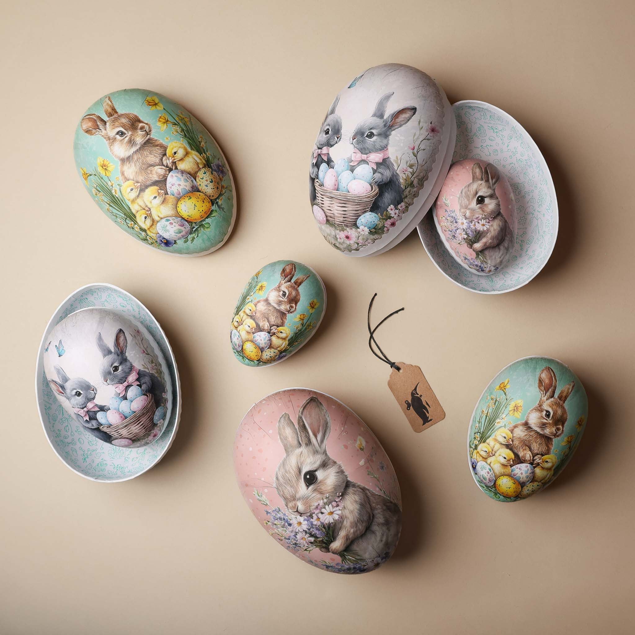 Decorative stones with rabbit and Easter egg designs on a beige background