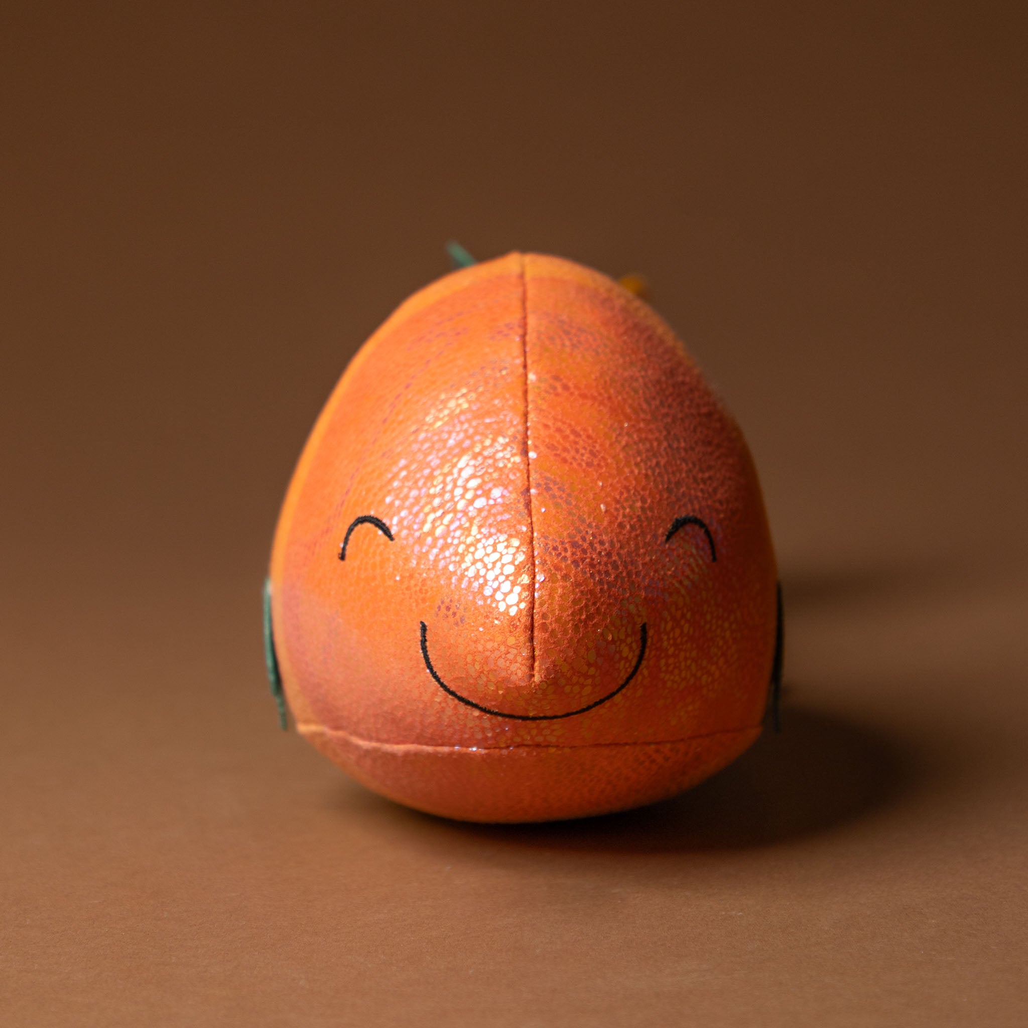 gil-the-guppie-fish with a smiley face on a brown background