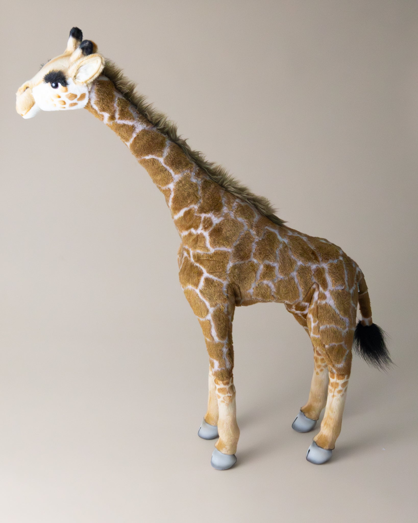 giraffe--standing-stuffed-animal-side-with-tail