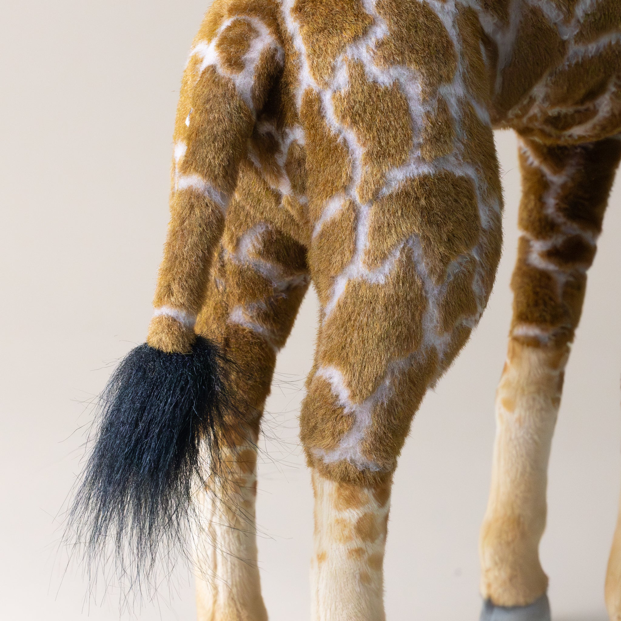 giraffe--standing-stuffed-animal-back-and-tail