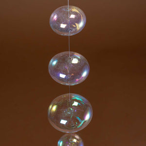 up-close-clear-glass-ball-strung-together