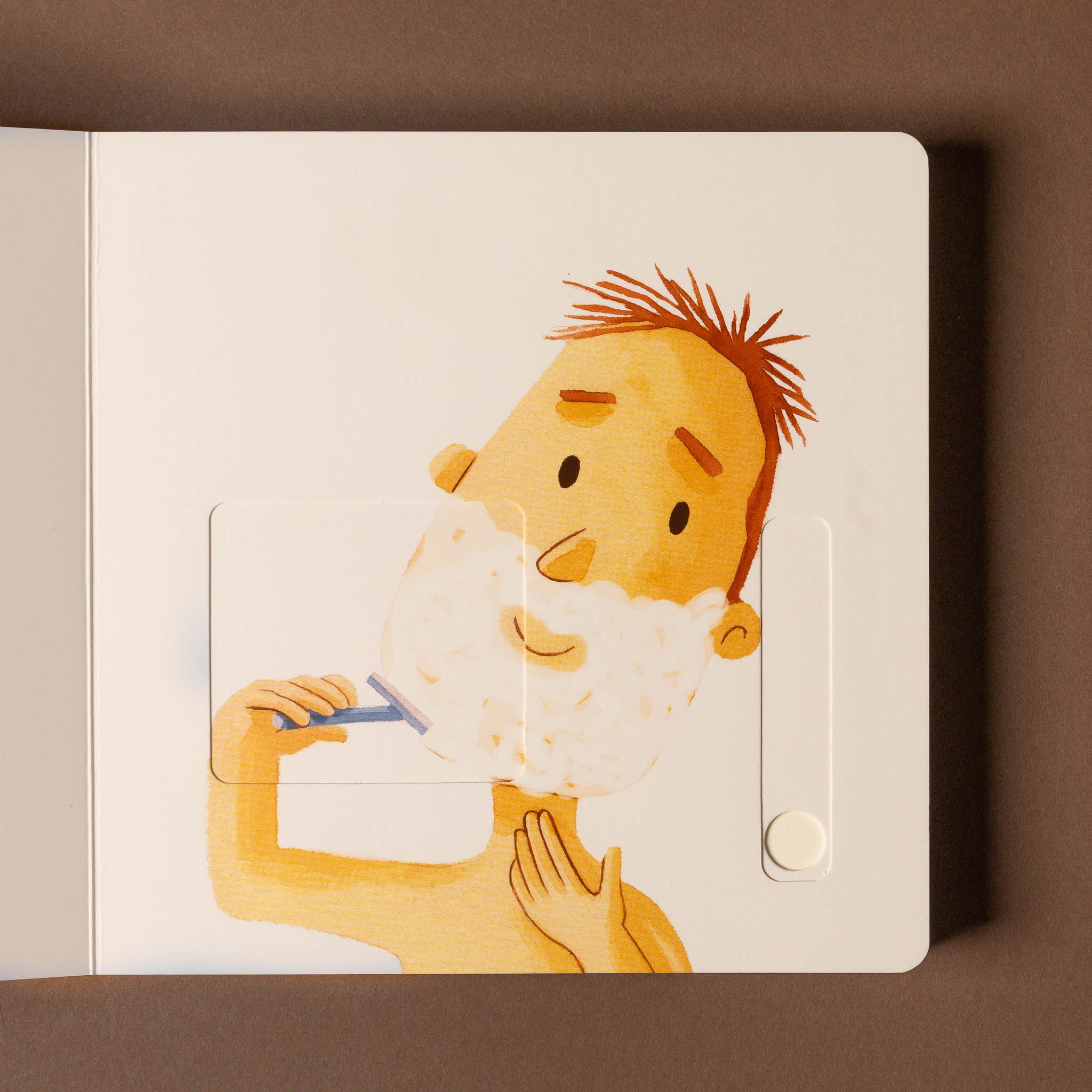 good-morning-buenos-dias-board-book Illustration of a person shaving with a razor on a notebook cover.
