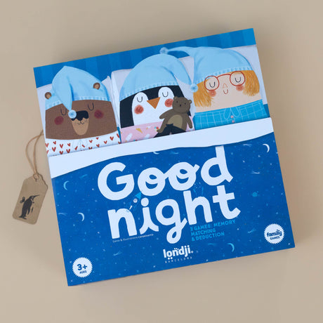 good-night-game-box-featuring-a-bear-penquin-and-child-in-night-caps-tucked-in-bed