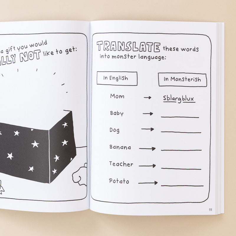 An open children's activity book or booklet showing printed pages with a black-and-white illustration and a word-mapping exercise titled 'Translate these words into monster language.'.
