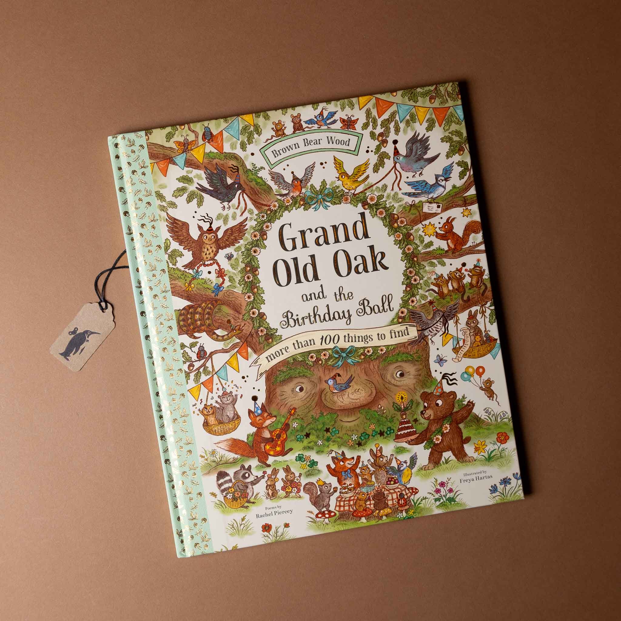 Children's book titled 'Grand Old Oak and the Birthday Ball' on a brown background