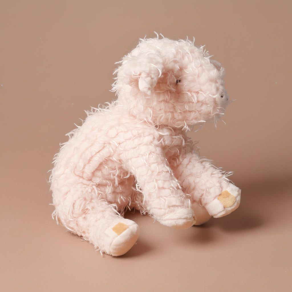 Pink textured hammie-the-pig-mediumon a brown background