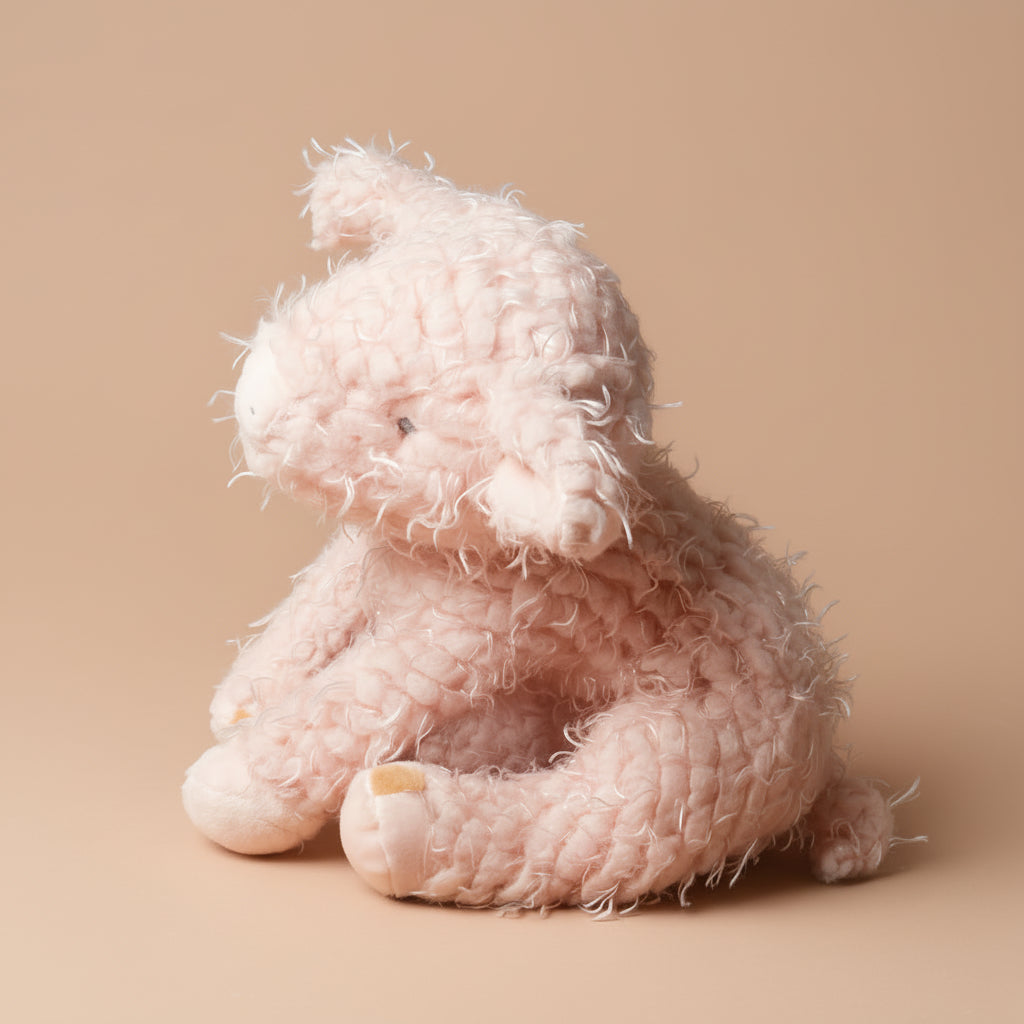 Pink texturedammie-the-pig-medium on a brown background