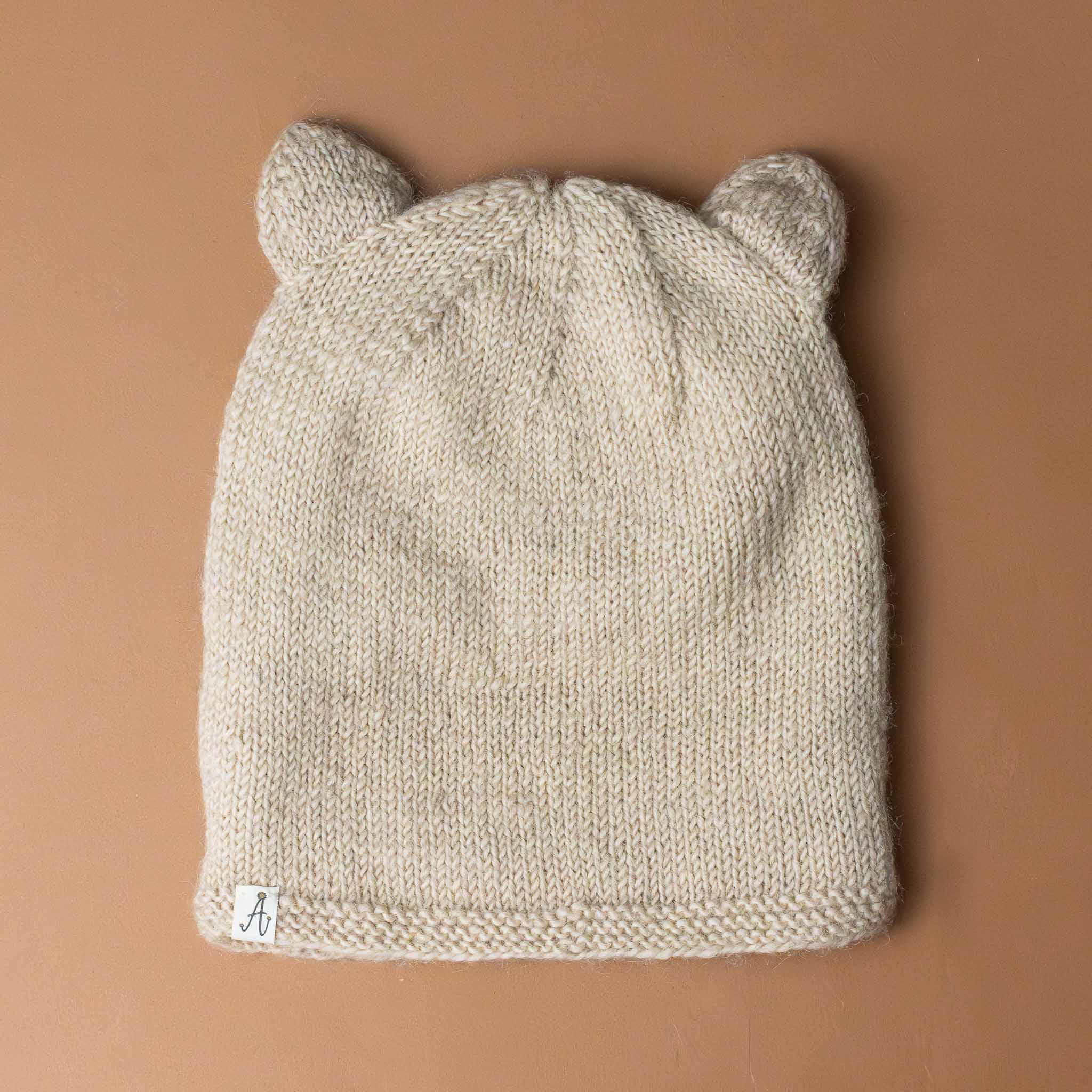 hand-knit-beige-bear-hat-back