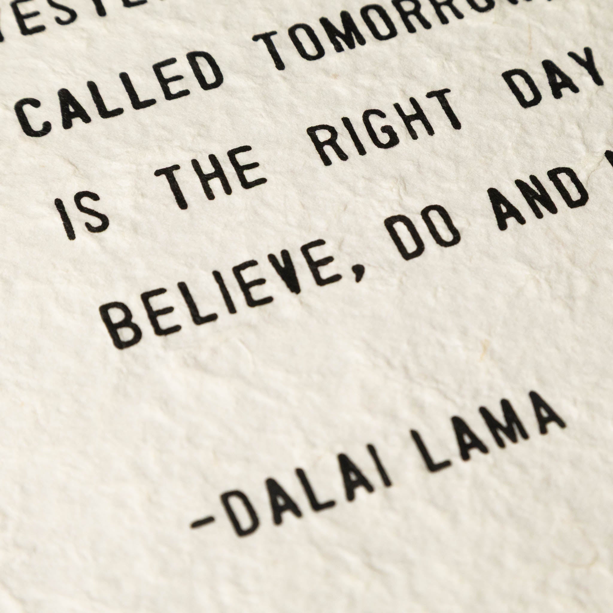 Text on a textured beige background with a quote by Dalai Lama.