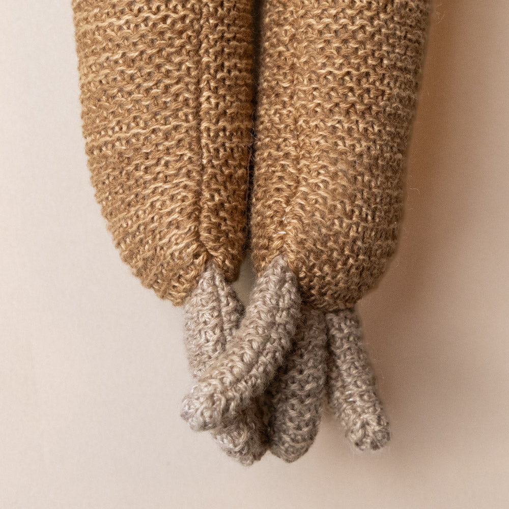 hanna-sloth Knitted brown and gray booties on a beige background