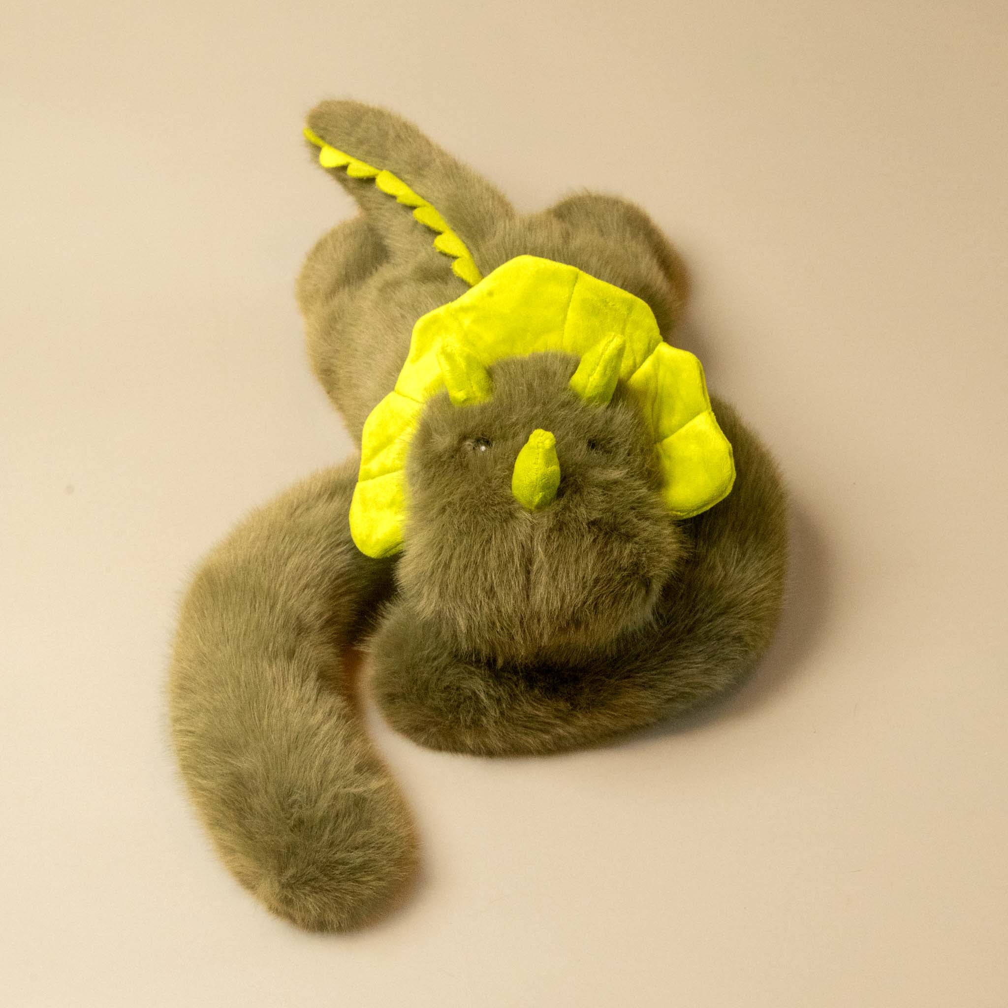 green weighted-dino stuffed animial