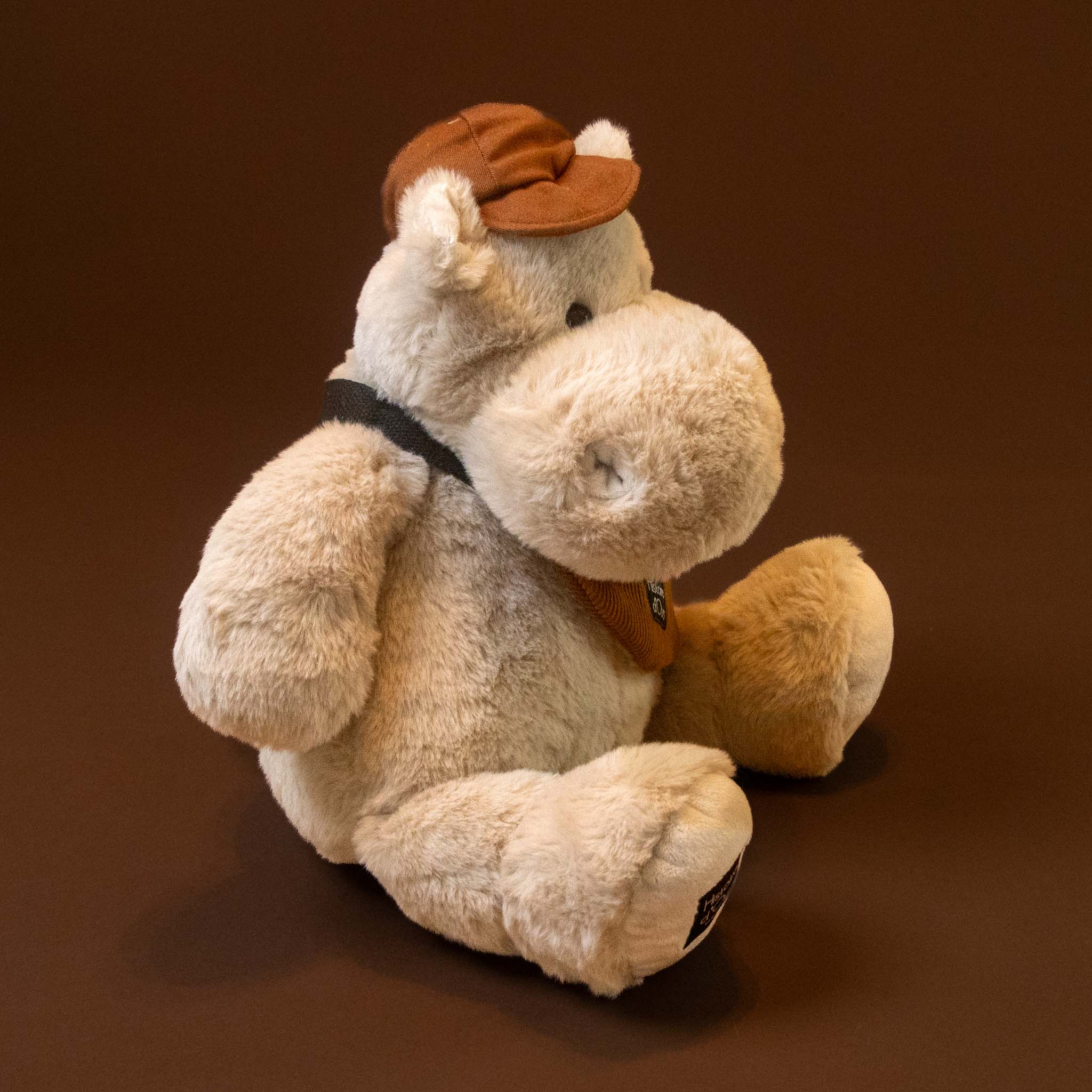 hip-hippo-world-traveler-grand with hat and bag stuffed animal