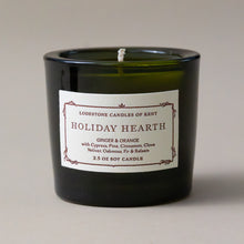 Load image into Gallery viewer, holiday-hearth-single-candle-from-holiday-candle-gifttrio-in-green-glass-jar-with-white-candle