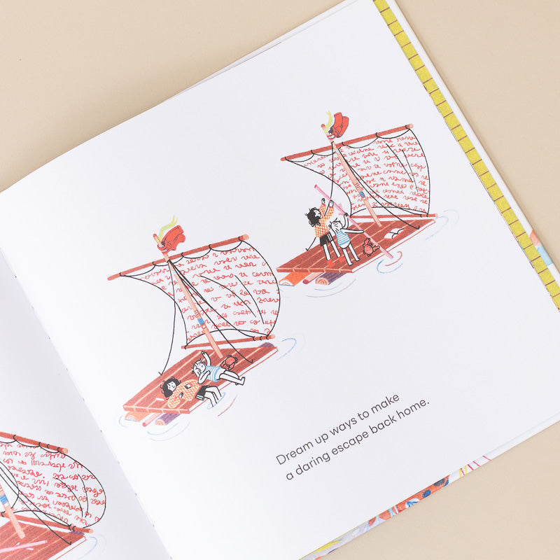 An open children's book or journal page showing an illustration of two children in sailboats with handwritten text in the sails, on a warm beige background.