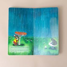 Load image into Gallery viewer, a-bunny-using-a-toadstool-as-shelter-from-the-rain-repeated-in-spanish-as-a-frog-watches-on