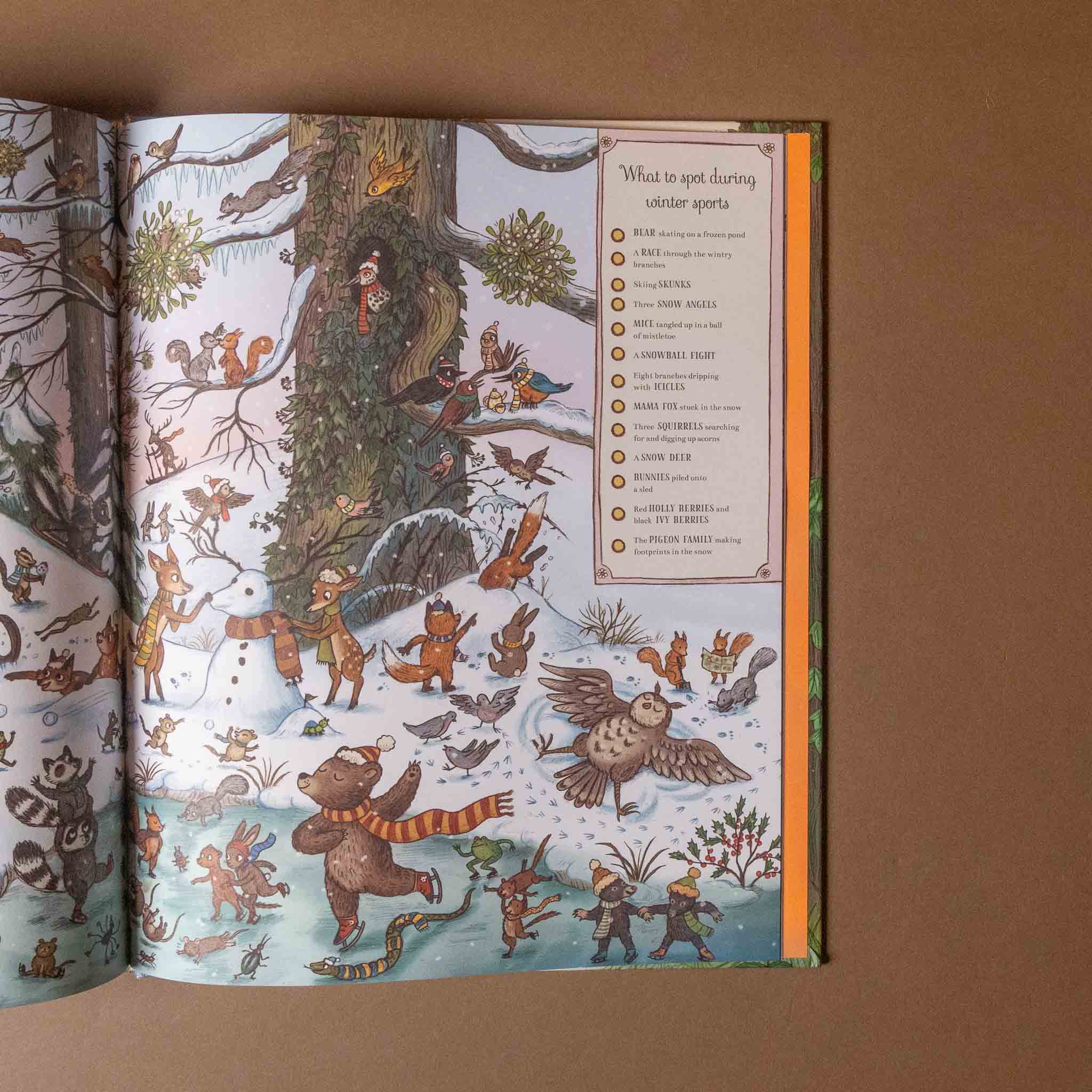 Illustrated if-you-go-down-to-the-woods-today-seek-and-find-book open to a page with winter forest scene and characters, on a brown background.