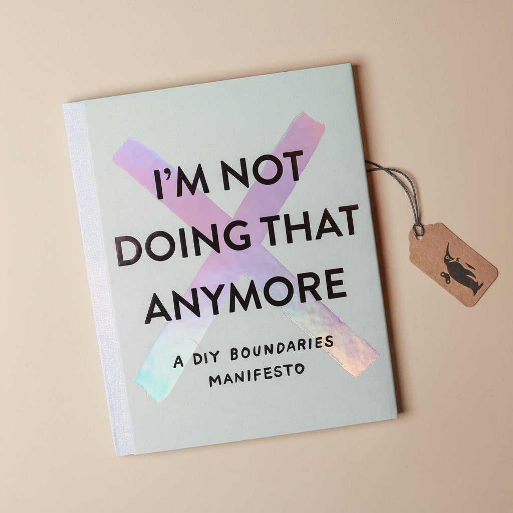Book titled 'I'm Not Doing That Anymore' with a tag on a beige background