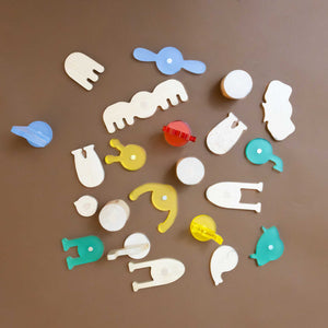 pieces-from-kit-wooden-and-plastic-in-yellow-red-blue-and-green