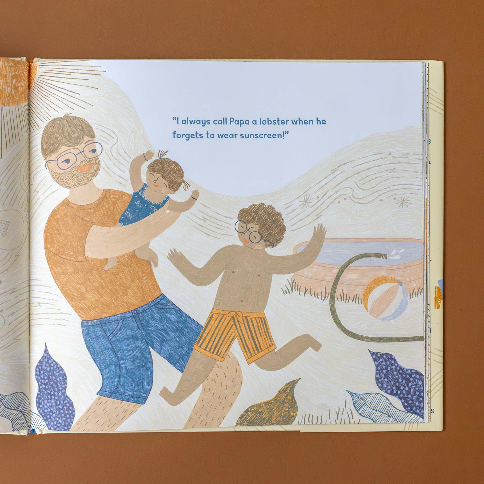 in-this-family-book-interior-page-with-illustration-of-child-on-the-beach-held-by-dad-with-brother-playing-text-i-always-call-papa-a-lobster-when-he-forgets-sunscreen