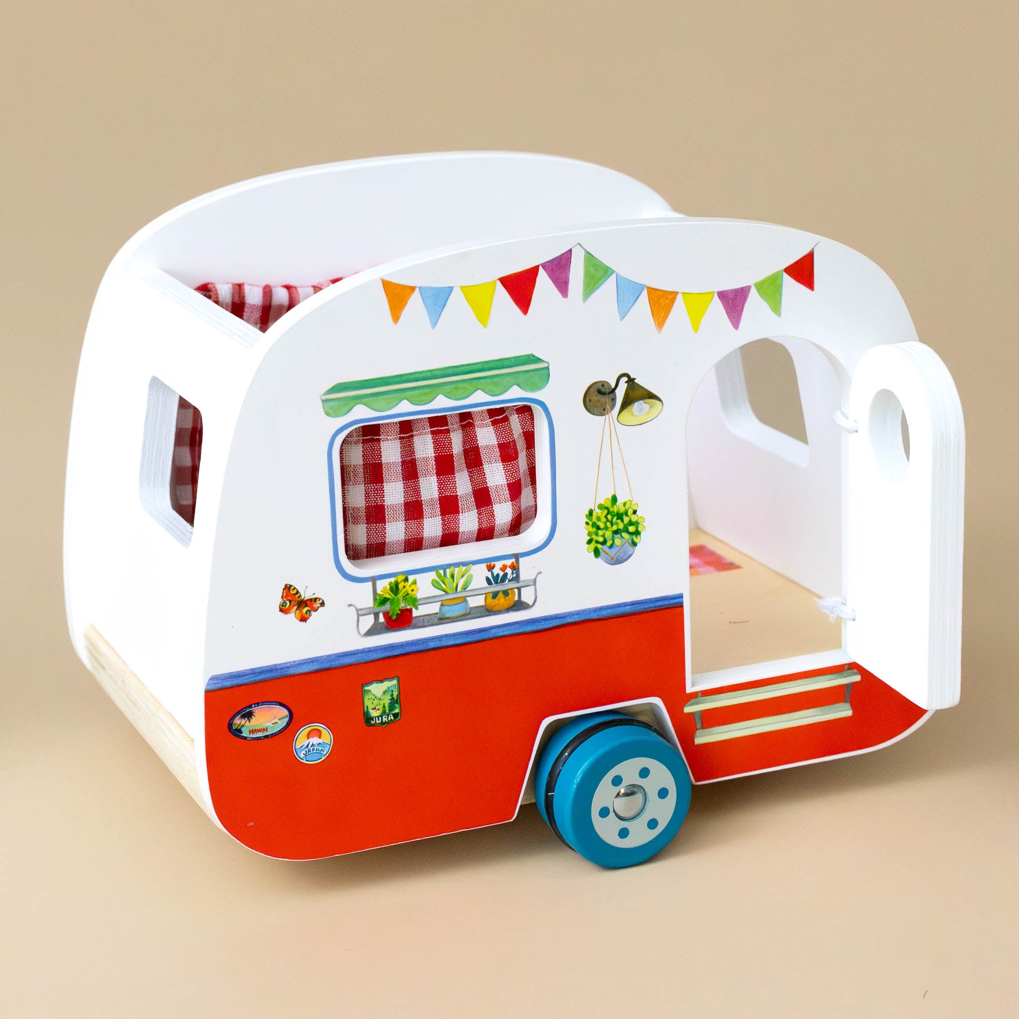 la-grande-famille-wooden-camper-play-set-with-red-gingham-curtains-colorful-flags-and-oval-door