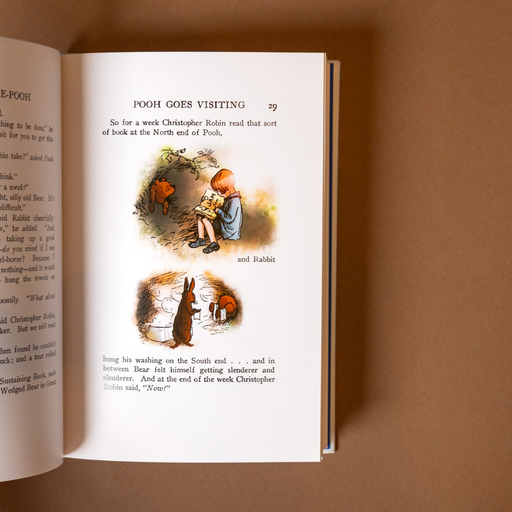 leather-bound-winnie-the-pooh-classic-edition Open book with illustrations of a child and animals on a brown background
