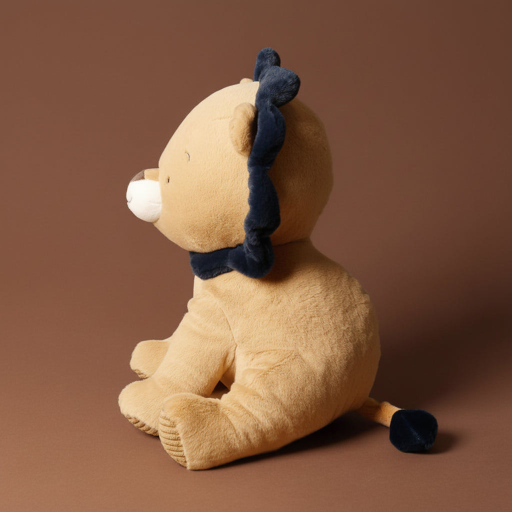 Plush toy with a blue bow on a brown background