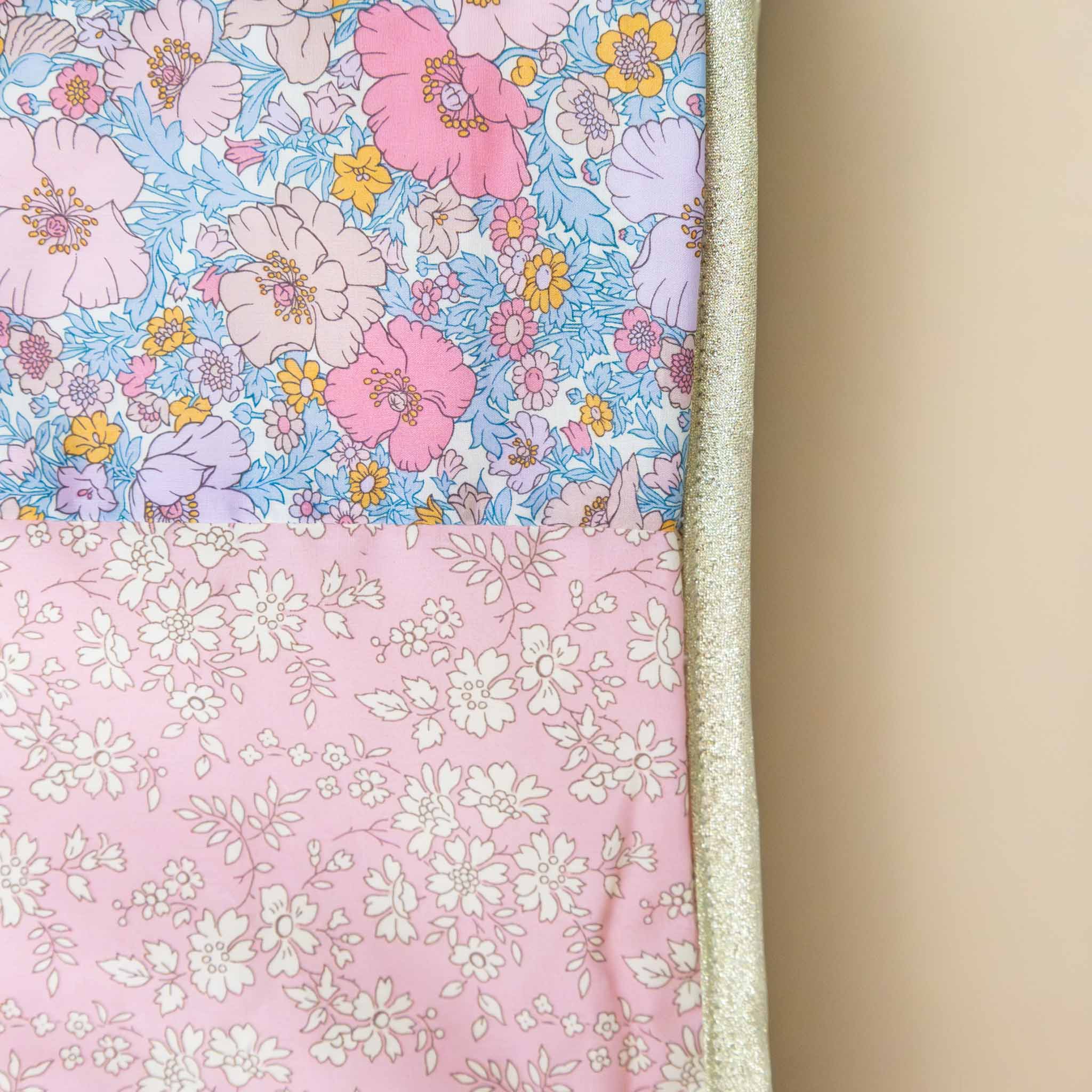 pink-floral-print-liberty-blanket-sofia-with-white-fleece-underside-and-gold-lame-bias-trim