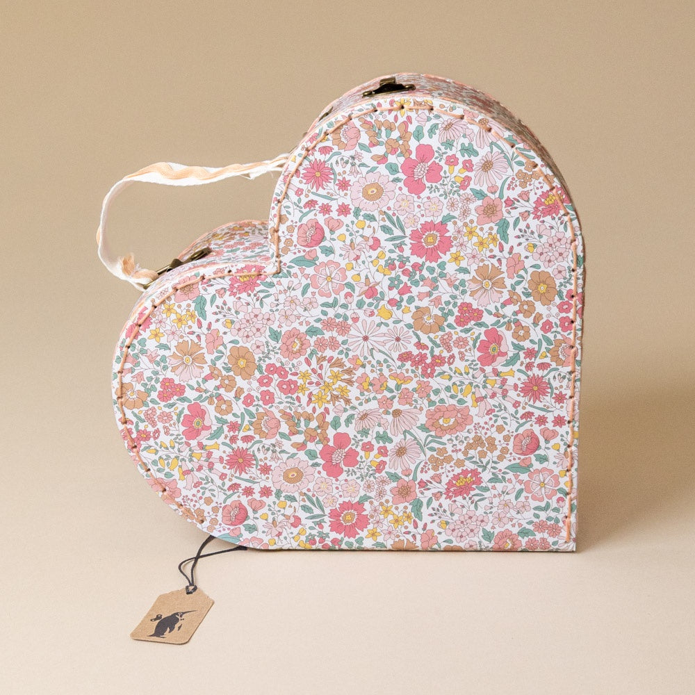 liberty-heart-suitcase-large floral-patterned box with a tag on a beige background