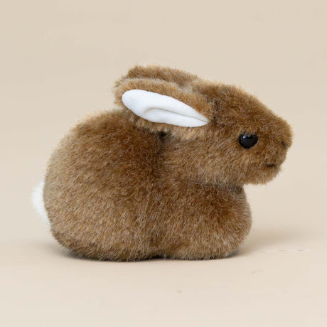 little-brown-bunny-crouching-stuffed-animal