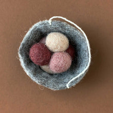Load image into Gallery viewer, grey felted nest ornament with three little beige and rose eggs