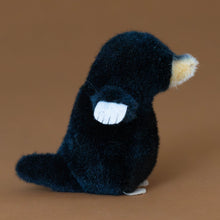 Load image into Gallery viewer, little-black-mole-standing-stuffed-animal-paddle-hands-snout-and-tail-from-the-side