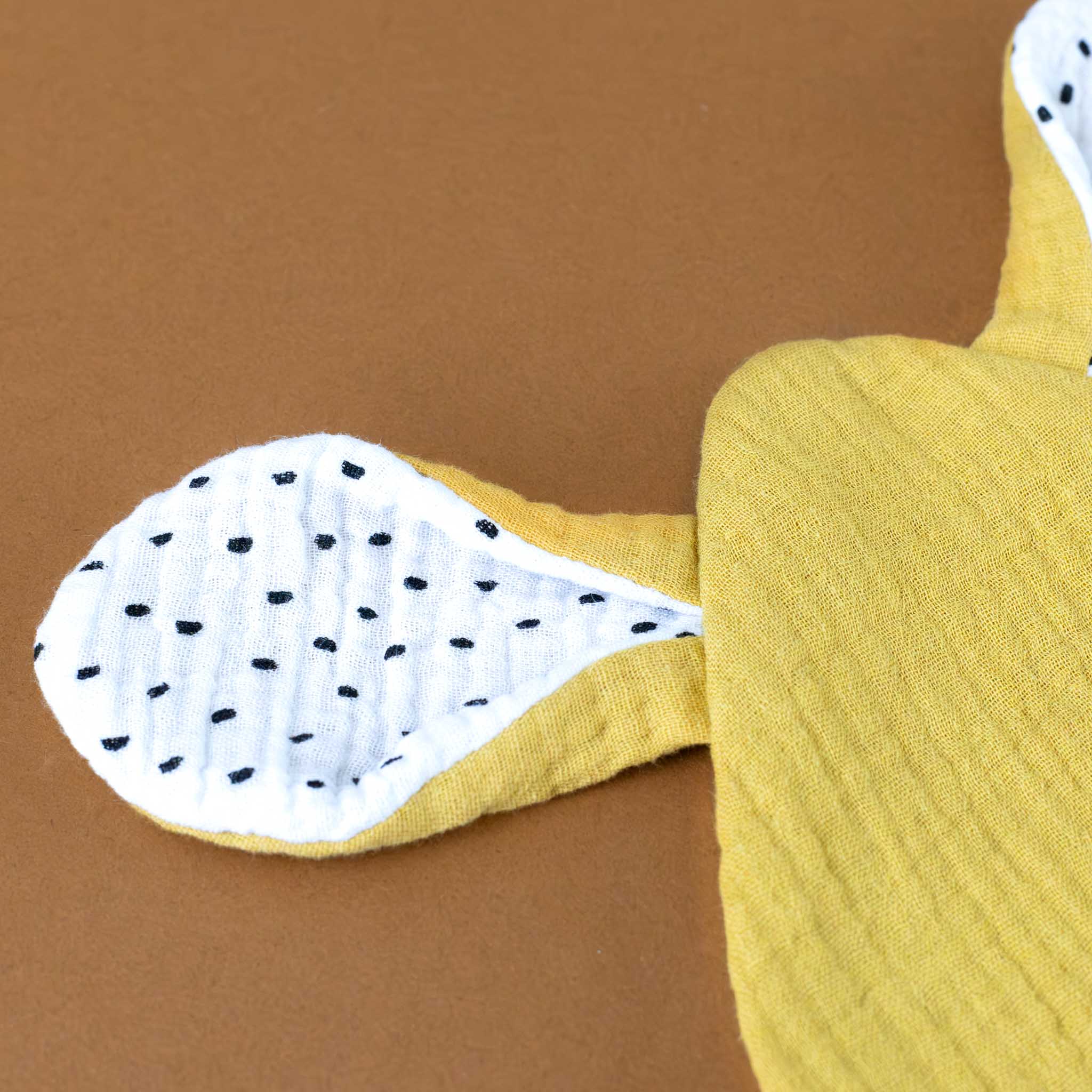 little-organic-cotton-muslin-bunny-lovie-ochre-ear-with-polka-dots