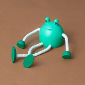 little-palimal-friend-green-wooden-frog-with-corded-legs-and-arms-and-big-eyes-legs-crossed